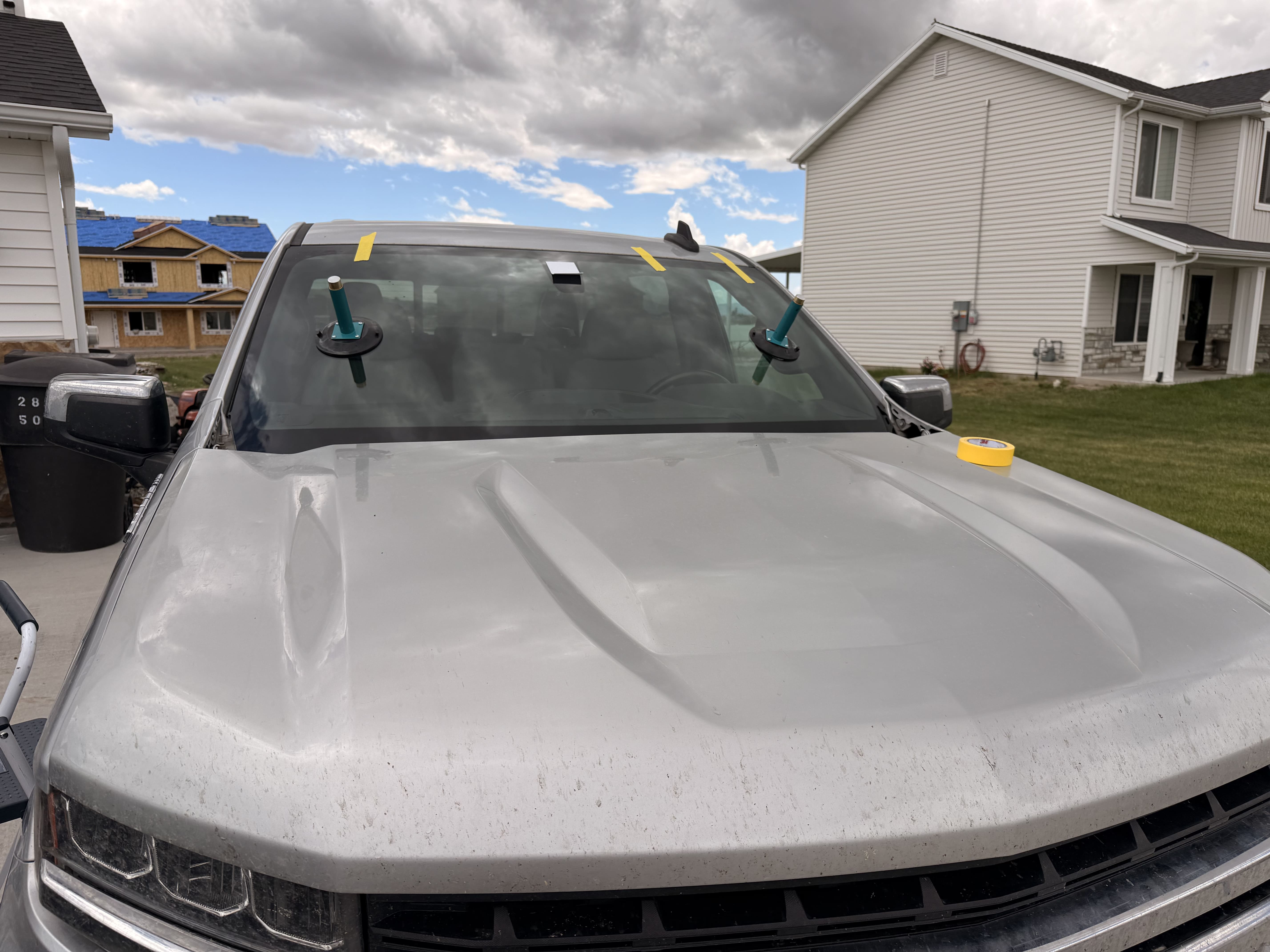 Silver truck with windshield replacement in progress in Monroeville